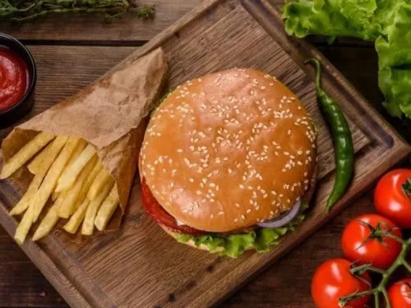craft-beef-burger-and-french-fries-on-a-black-background-e1664111539632-pva8sagilj6a4q7l5zzsgjm0asryc2d6cke76y1u2w